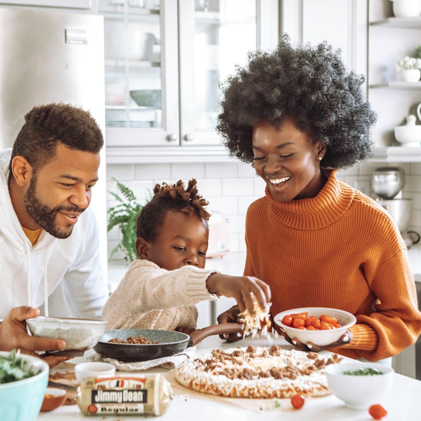 Community members collaborating in a modern kitchen space, sharing recipes and cooking techniques